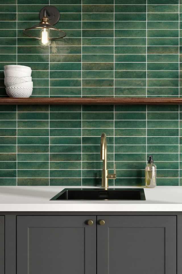 glossy green ceramic tile backsplash in kitchen with modern farmhouse lighting
